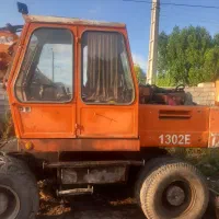 بیل مکانیکی لاستیکی اطلس