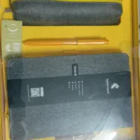 تعدادی لوازم التحریر ،دفتر ،فندک و بازی فکری