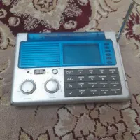 رادیو و ماشین حساب دار ساعت دار