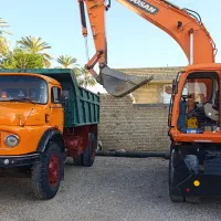 اجاره بیل لاستیکی و کمپرسی حمل مصالح ساختمانی