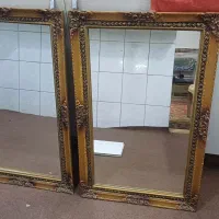 دو عدد آینه با قاب طلایی رنگ