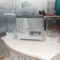 یک عدد آبمیوه گیر
