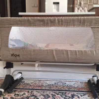 گهواره و تخت کنار مادر