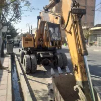 بیل مکانیکی کوماتسو۱۰۰ لاستیکی
