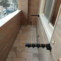 بند رخت دیواری تاشو کم جا
