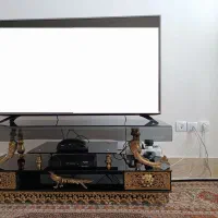 میزتلویزیون و ساعت برنز اصل درحدنو
