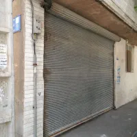 ساختمانه-دو-طبقه-با-مغازه-تجاری