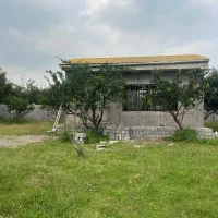 زمین۵۰۰متری سند/با بنای نیم‌ساخته/با درختان پرتقال