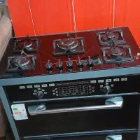 گاز پنج شعله صفحه شیشه ای سه کشو طرح فر در حد نو