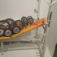 دستگاه بدنسازی همراه با وزنه و هالتر