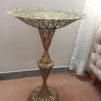 میوه خوری برنزی کنار سالنی