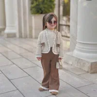 خیاط بیرون بر لباس بچگانه