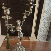 یک جفت شمعدان برنز و یک جفت شمعدان برنج