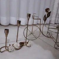 سه عدد شمعدان ویک عدد دوچرخه