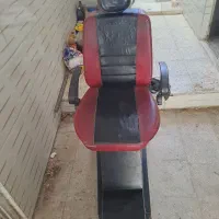 صندلی آرایشگاه، یک تلوزیون اطلس ۲۱،