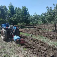 کار با تراکتور باغی