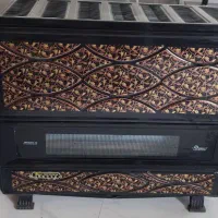 دوعدد بخاری ایران شرق و چرخ خیاطی