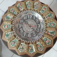 ساعت خاتم کاری و قلم زده شده