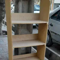 قفسه کتاب وغیره ومیز تلویزیون همگی سالم