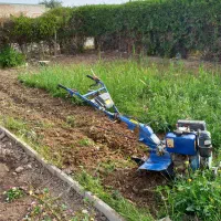 شخم زدن زمین با دستگاه تیلر و امور باغبانی