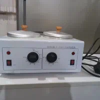 تخت معاینه و وارمر دوکاسه ای برای استفاده از موم