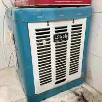 کولر ابی بادپاک پشت پنجره
