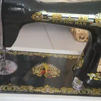 چرخ خیاطی مرد پرنده