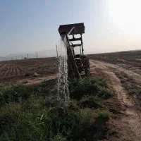 فروش یکدستگاه تراکتور همراه با بیل جلو