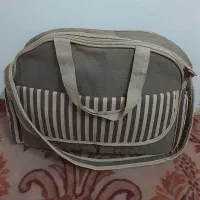 کیف بچه و رخت خواب و آغوش بند بچه