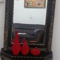 یک عدد ساعت و آینه و شمعدان