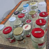 تعدادی شیشه و دبه ماست برای رب و ترشی