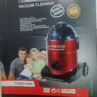 جارو برقی و میز تلویزیون