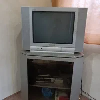 تلویزیون panasonic به همراه میز تلویزیون