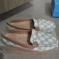 کفش آکبند و نوو|کیف، کفش، کمربند|مهاجران, |دیوار