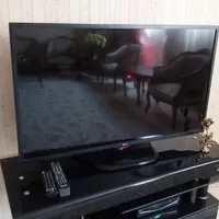 فروش tv برند LG بهمراه میز شیشه ای