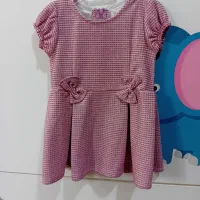 چند دست لباس دخترانه اکبند و دو سه بار پوشیده شده