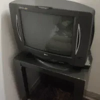 تلویزیون الجی با میز و دستگاه دیجیتال