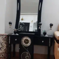 آینه شمعدان و ساعت دیواری