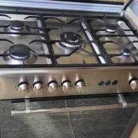 اجاق گاز تمام استیل فردار و جوجه گردان سینجر