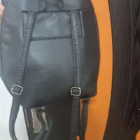 تعدادی کیف و کفش و بلوز