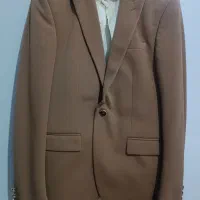 کت شلوار مردانه و تعدادی لباس زنانه