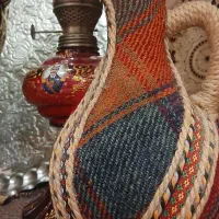 پارچ سنتی سفالی دور گلیم بافی