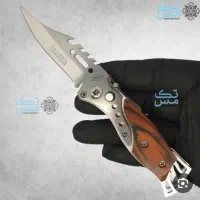 چاقو اصل آمریکایی ضامن دار با هک شدن اسمش