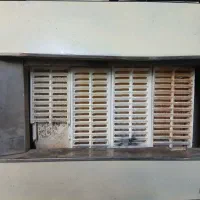 بخاری گازی کوچک و دیواری سفالی هر دو با دودکش