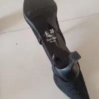 کفش مجلسی|کیف، کفش، کمربند|ری, شهید غیوری (ابن باویه)|دیوار