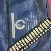 چرتکه به همراه سه کتاب و کیف