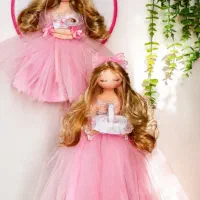 عروسک مادر و دیوار کوب عروسکی