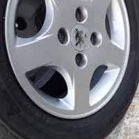 رینگ و لاستیک ۲۰۷ با لاستیک چینی ۹۵ درصد سایز ۱۴