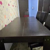 میز ناهارخوری چوبی ۱۰ تا ۱۲ نفر همراه با صندلی چرم