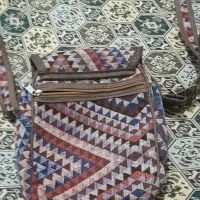 کیف دوشی|کیف، کفش، کمربند|رشت, فلسطین|دیوار